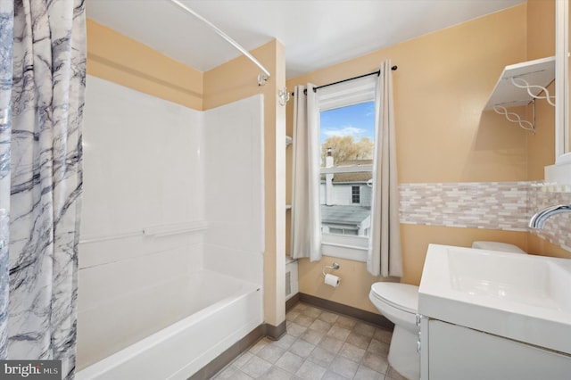 full bathroom featuring vanity, shower / bath combo, and toilet