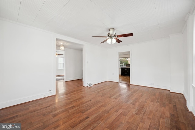 unfurnished room with wood-type flooring, ceiling fan, and crown molding