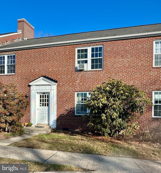 view of front of home featuring cooling unit