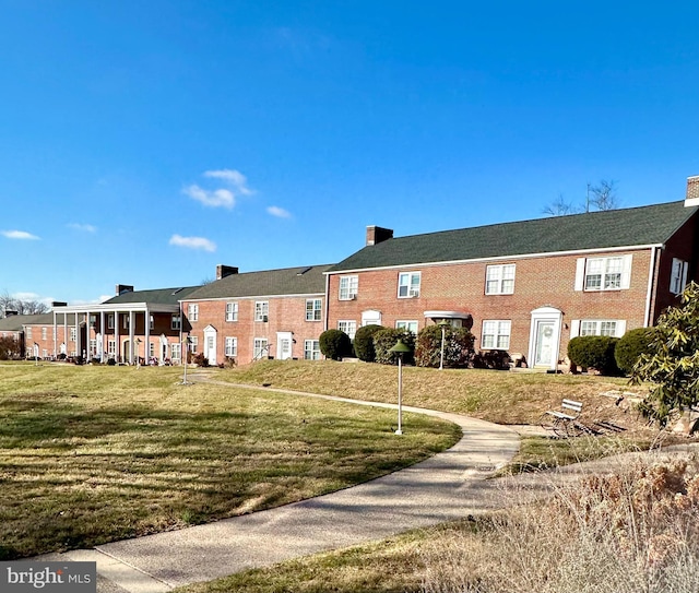 exterior space featuring a lawn