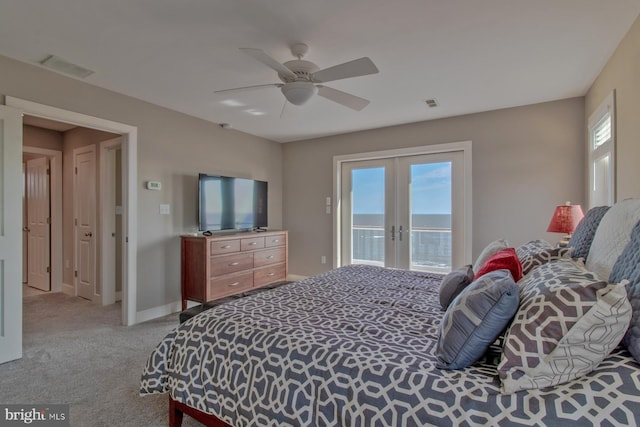 bedroom featuring access to outside, ceiling fan, french doors, and light carpet