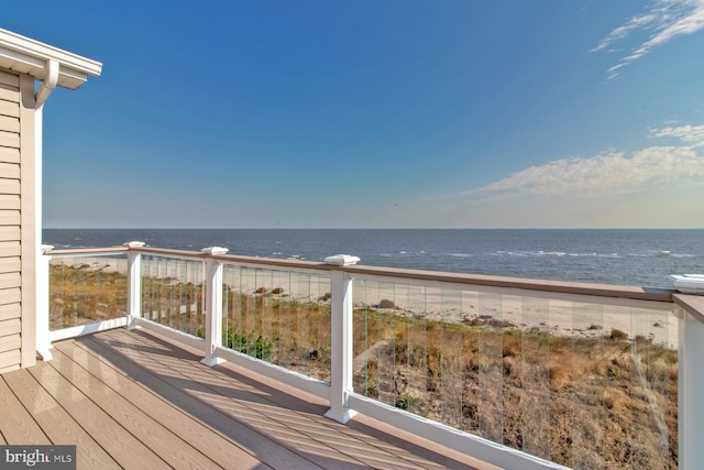 wooden deck with a water view