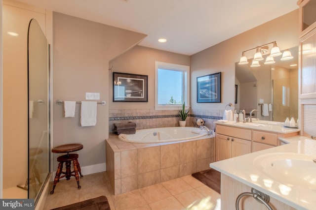 bathroom featuring tile patterned flooring, vanity, and plus walk in shower