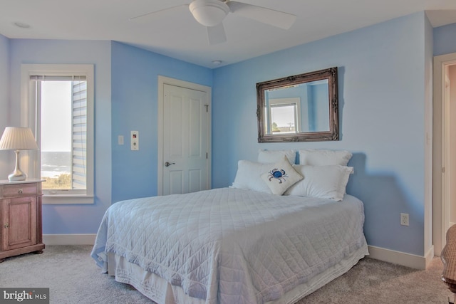 carpeted bedroom featuring ceiling fan