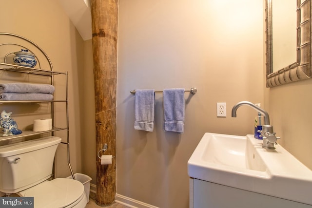 bathroom featuring toilet and sink