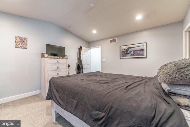 carpeted bedroom featuring vaulted ceiling