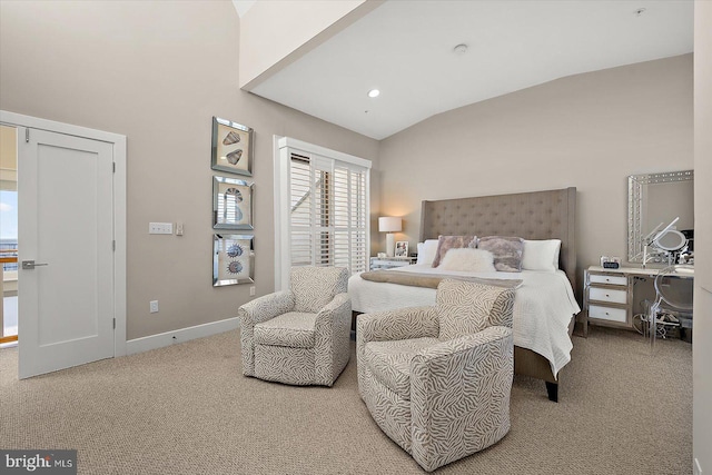 bedroom featuring carpet and vaulted ceiling