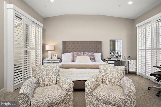 bedroom featuring carpet floors and vaulted ceiling