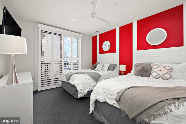 bedroom featuring dark carpet and ceiling fan