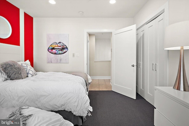 carpeted bedroom featuring a closet