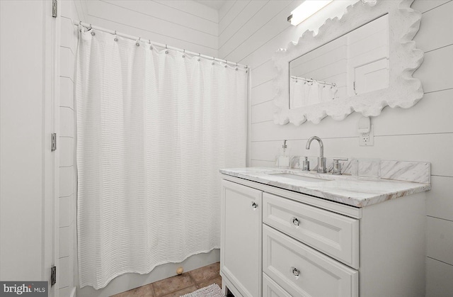 bathroom featuring vanity and shower / bath combination with curtain