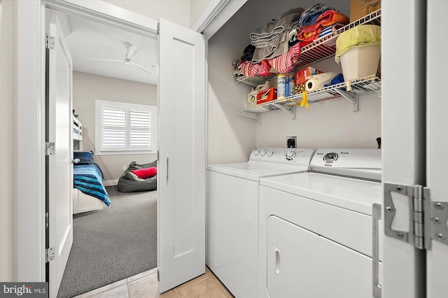 washroom with light colored carpet and washer and clothes dryer