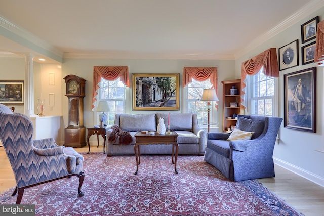 living room featuring hardwood / wood-style flooring, plenty of natural light, and ornamental molding