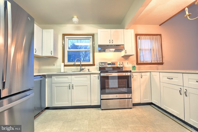 kitchen with white cabinetry, sink, and appliances with stainless steel finishes