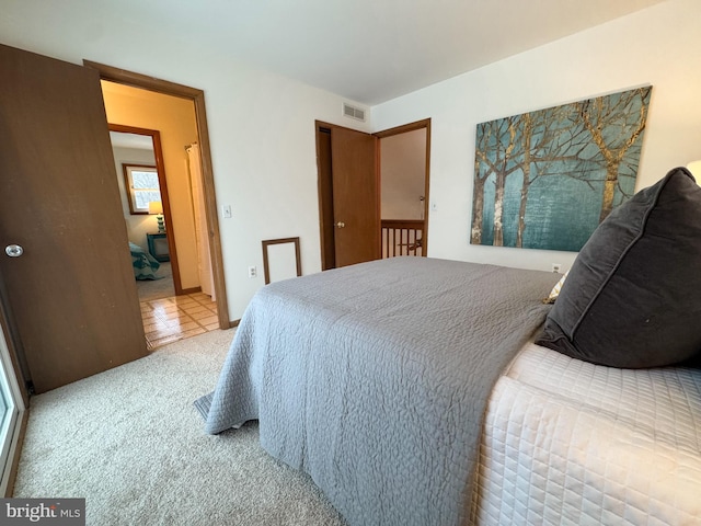 bedroom with light carpet