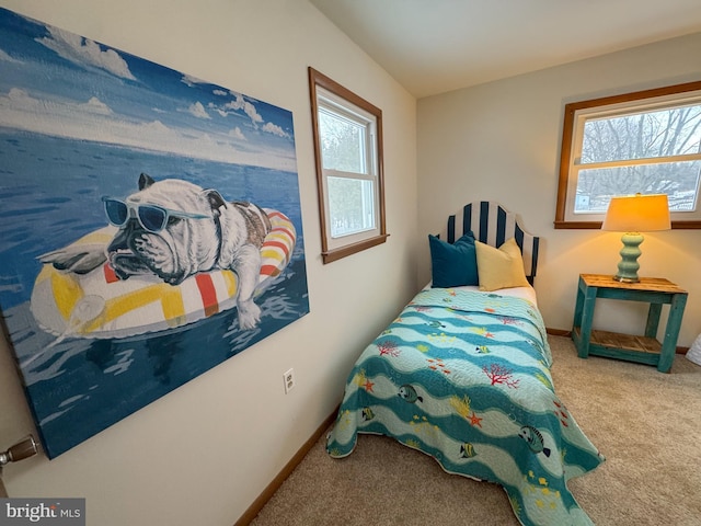 bedroom with multiple windows and carpet floors