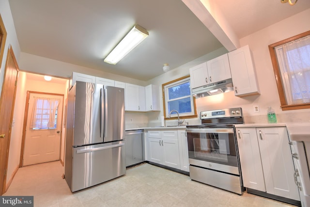 kitchen featuring white cabinets, sink, and appliances with stainless steel finishes