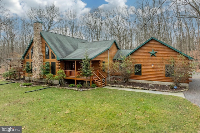 1212 Acacia, Hawley, PA 18438 - log cabin with log exterior, a front yard, and a chimney