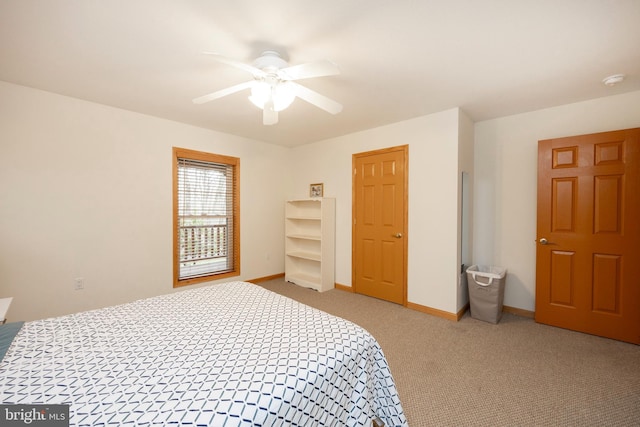 bedroom with ceiling fan and carpet