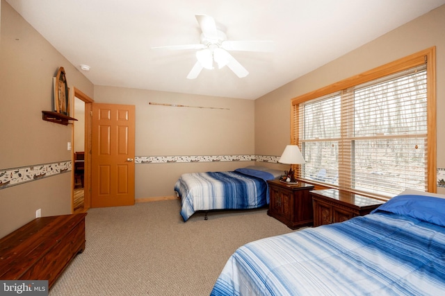 bedroom with light colored carpet and ceiling fan