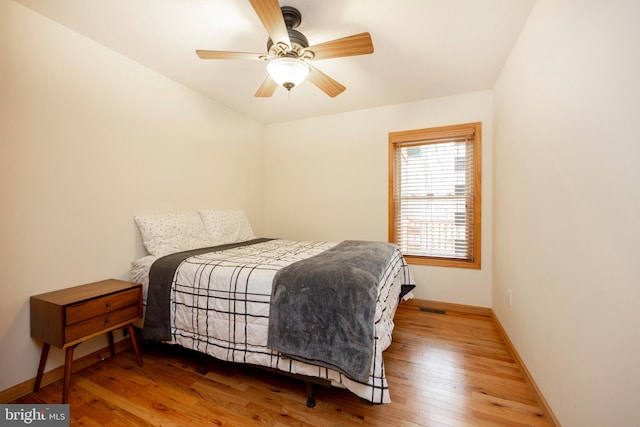 bedroom featuring ceiling fan and hardwood / wood-style flooring