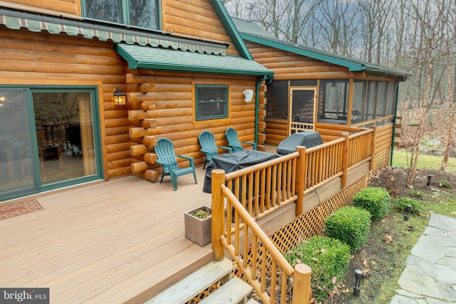 deck with a sunroom