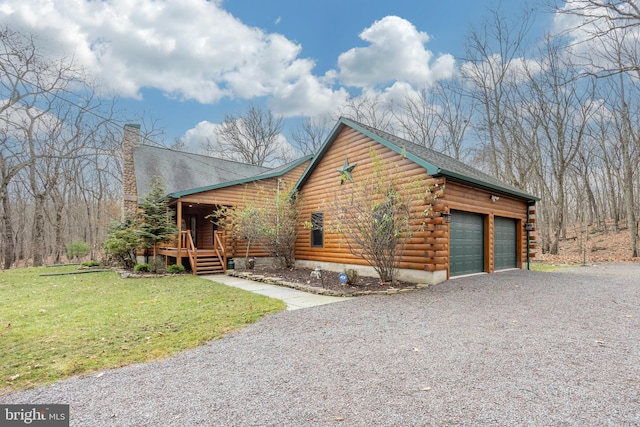 view of front of property with a front yard, a porch, and a garage