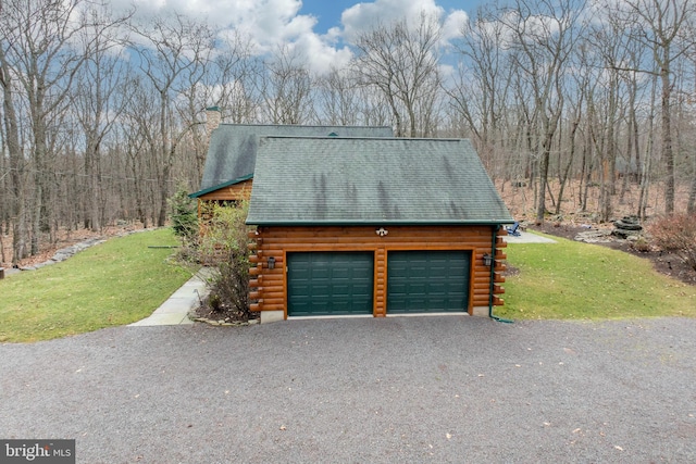 garage featuring a yard