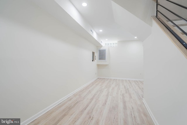 basement featuring light hardwood / wood-style floors