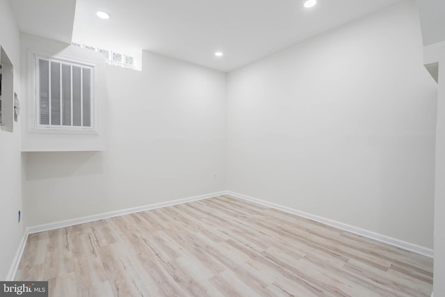 spare room with light hardwood / wood-style floors