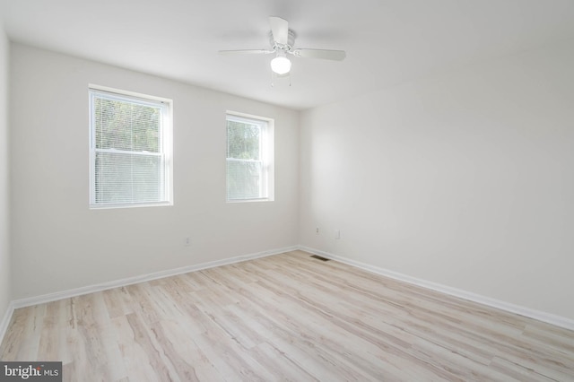 unfurnished room featuring ceiling fan and light hardwood / wood-style flooring