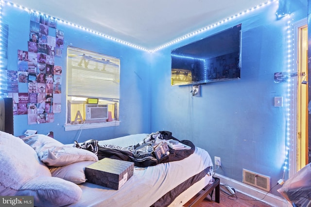 bedroom featuring hardwood / wood-style floors