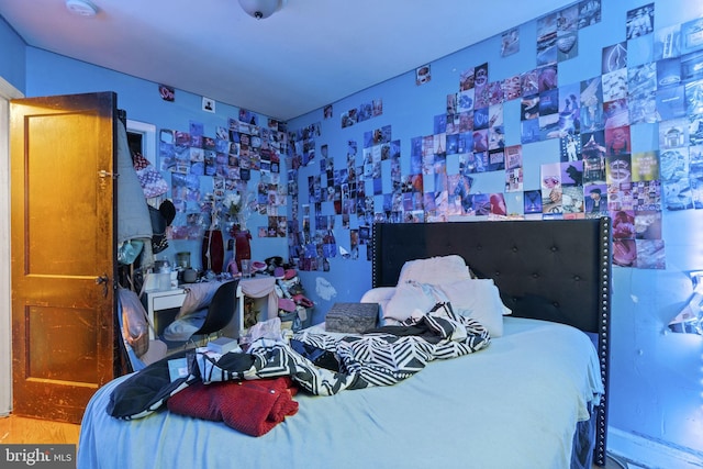 bedroom with wood-type flooring