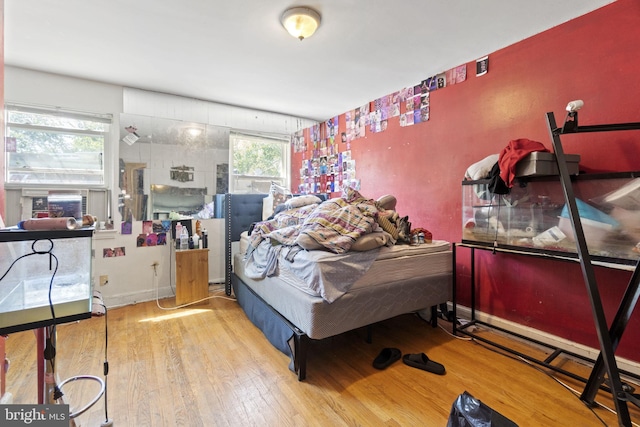 bedroom with hardwood / wood-style floors