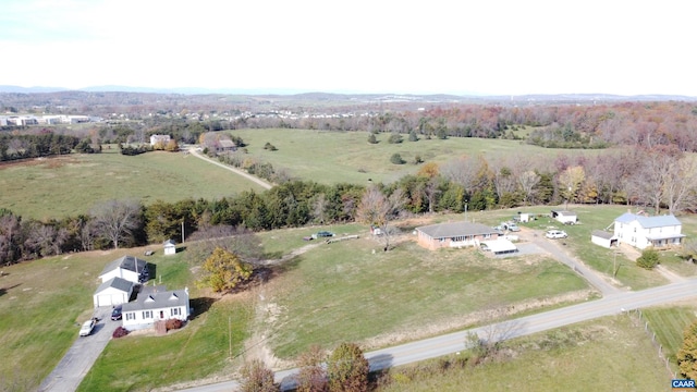 birds eye view of property with a rural view