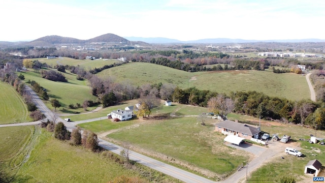 aerial view with a mountain view and a rural view