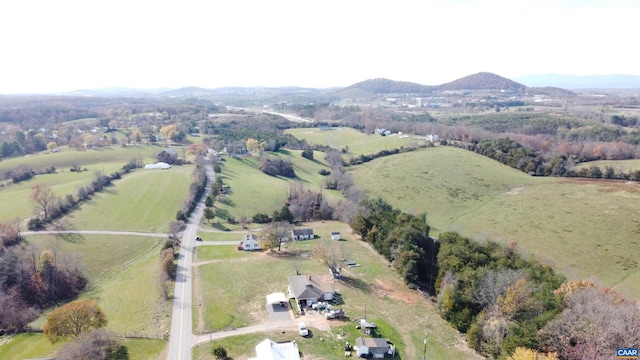 birds eye view of property with a mountain view and a rural view