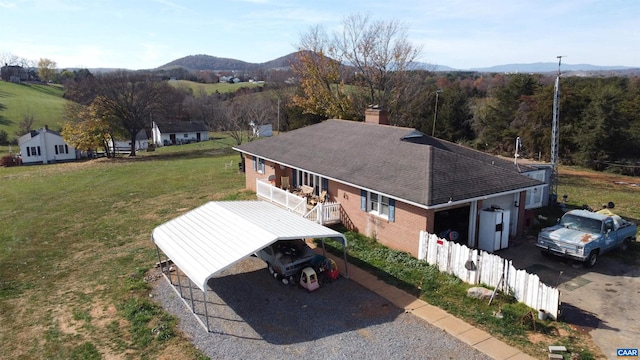 birds eye view of property featuring a mountain view