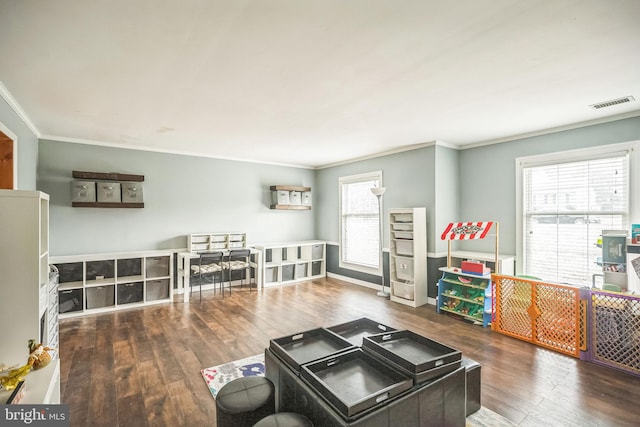 living room featuring hardwood / wood-style floors and crown molding