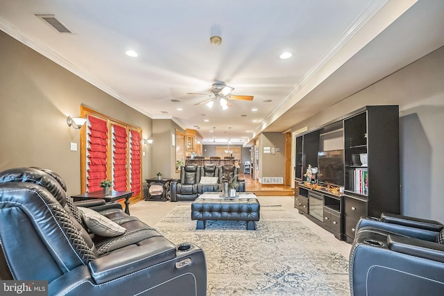 carpeted living room featuring ceiling fan and crown molding