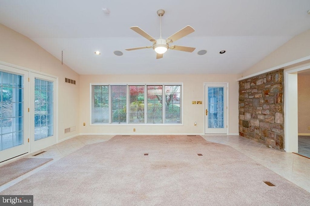 unfurnished living room featuring ceiling fan, light colored carpet, and lofted ceiling