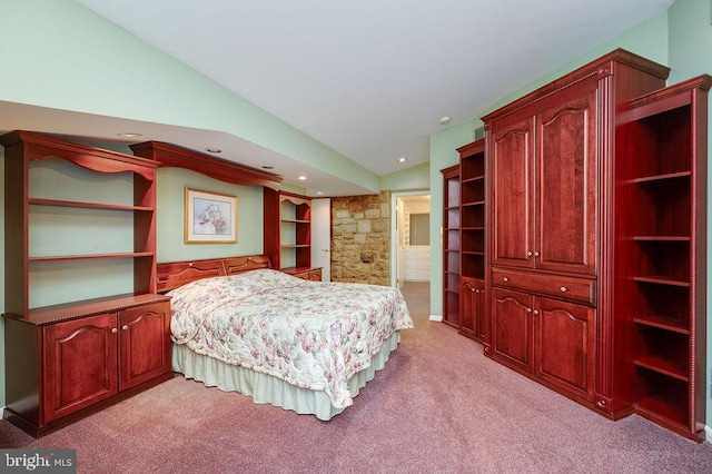 bedroom with light carpet and vaulted ceiling