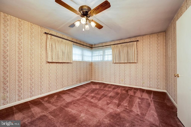 carpeted spare room featuring ceiling fan