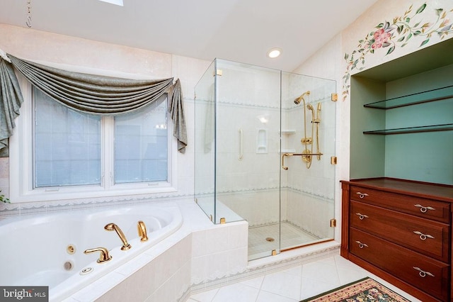 bathroom with tile patterned floors and shower with separate bathtub