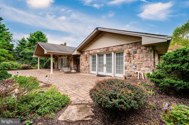 rear view of house with a patio and french doors