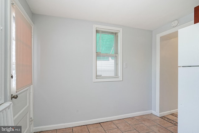 spare room featuring radiator heating unit