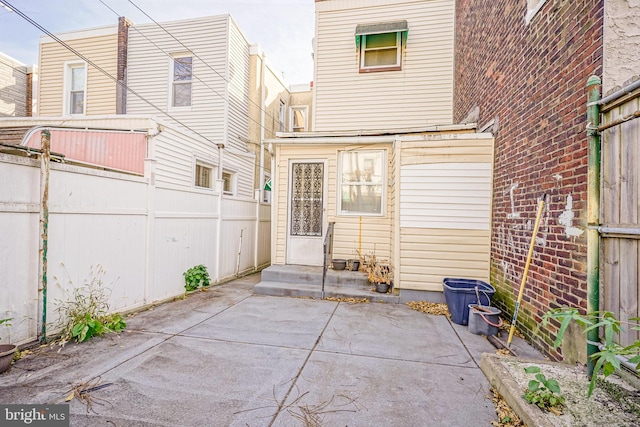 back of house with a patio area