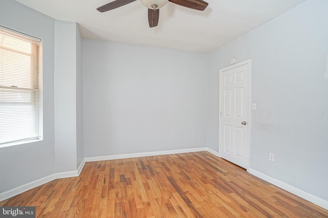 unfurnished room featuring light hardwood / wood-style flooring and ceiling fan