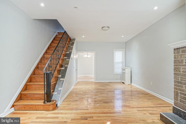 stairs featuring hardwood / wood-style flooring