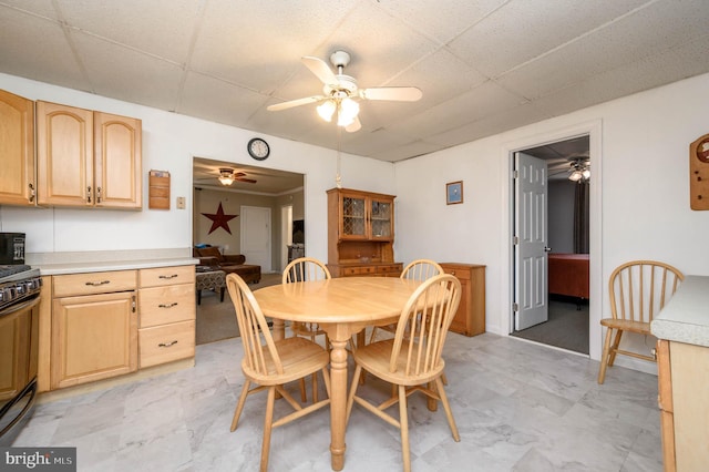 dining area featuring a paneled ceiling